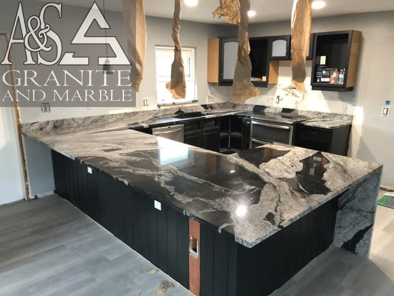 Beautiful polished finish black and white Waimeia Quartzite countertops - with mitered waterfall legs for countertops.